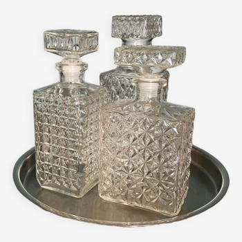 Set of three glass decanters