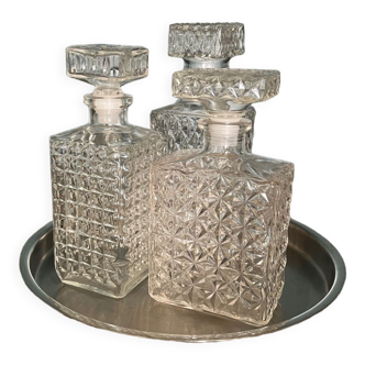 Set of three glass decanters