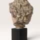 Plaster bust on a wooden base