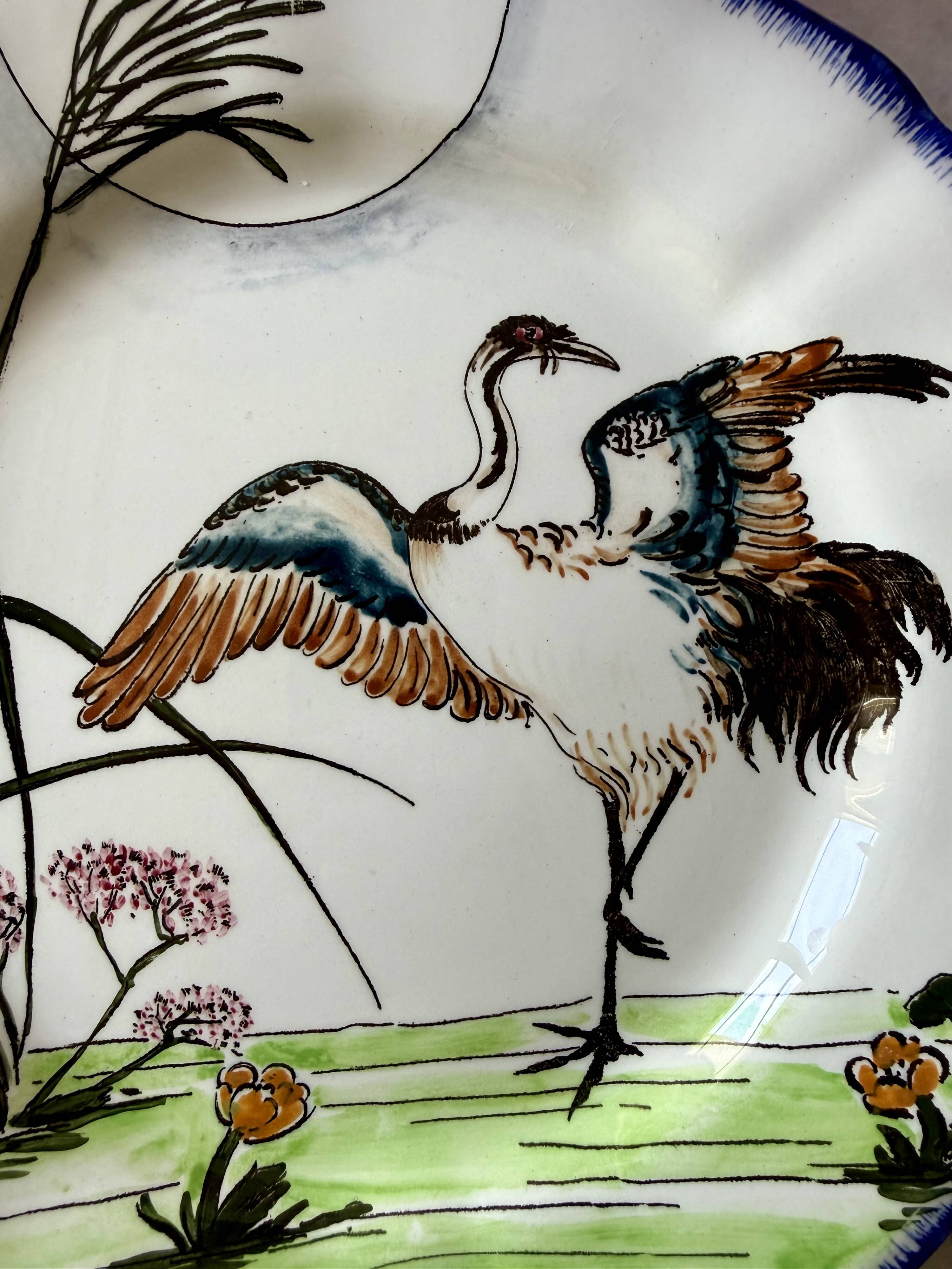 Service de table assiettes et plats Gien modèle grands oiseaux