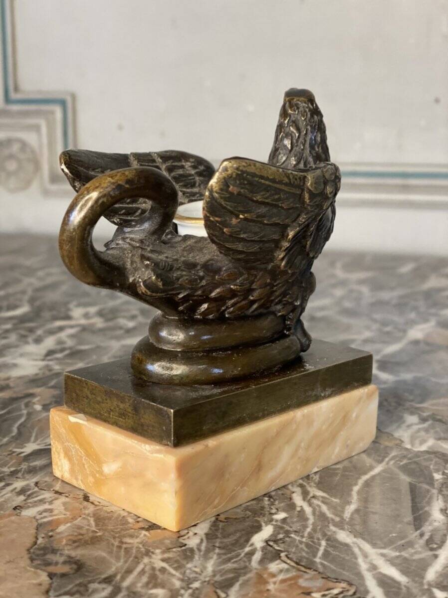 Eagle and serpent, bronze inkwell on a marble base.