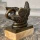 Eagle and serpent, bronze inkwell on a marble base.