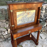 A small piece of Bonheur du jour with detached columns in Empire-era mahogany.