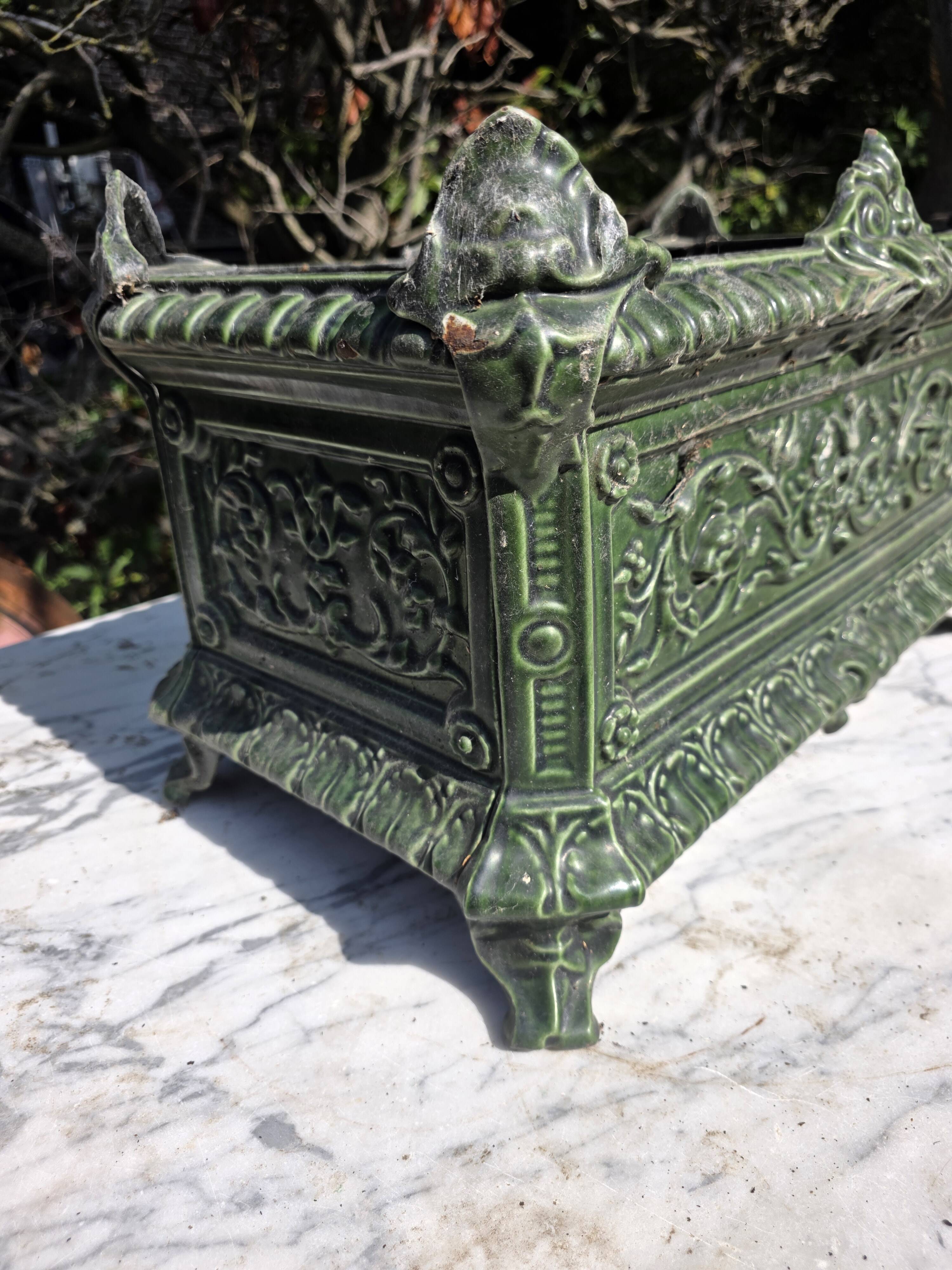 Antique enamelled cast iron planter in the Napoleon III style.
