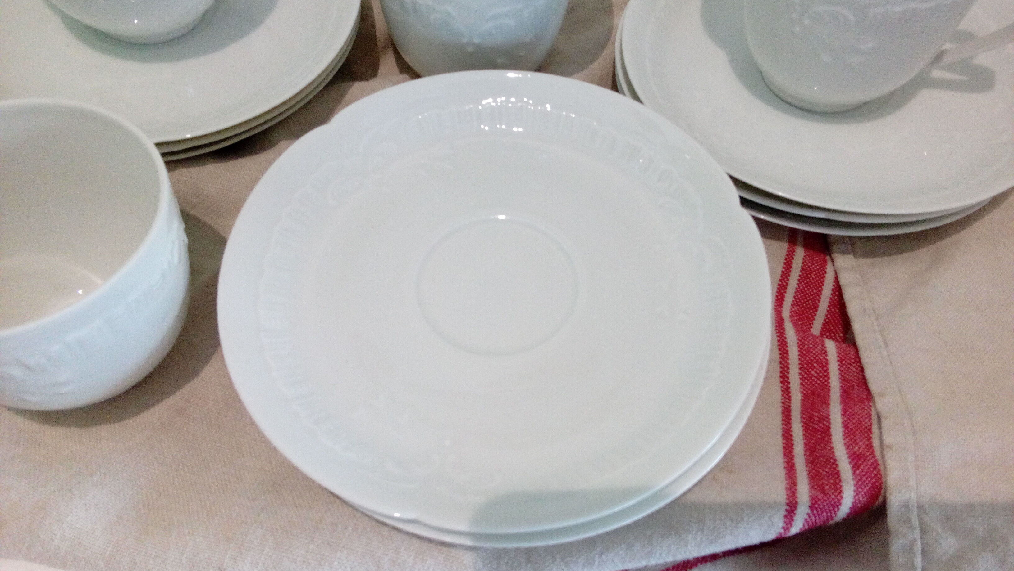 Set of 9 white porcelain coffee cups