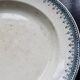 Round vintage patinated ironstone serving dish - Border model