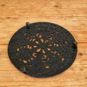Black cast iron trivet in a chic country style.
