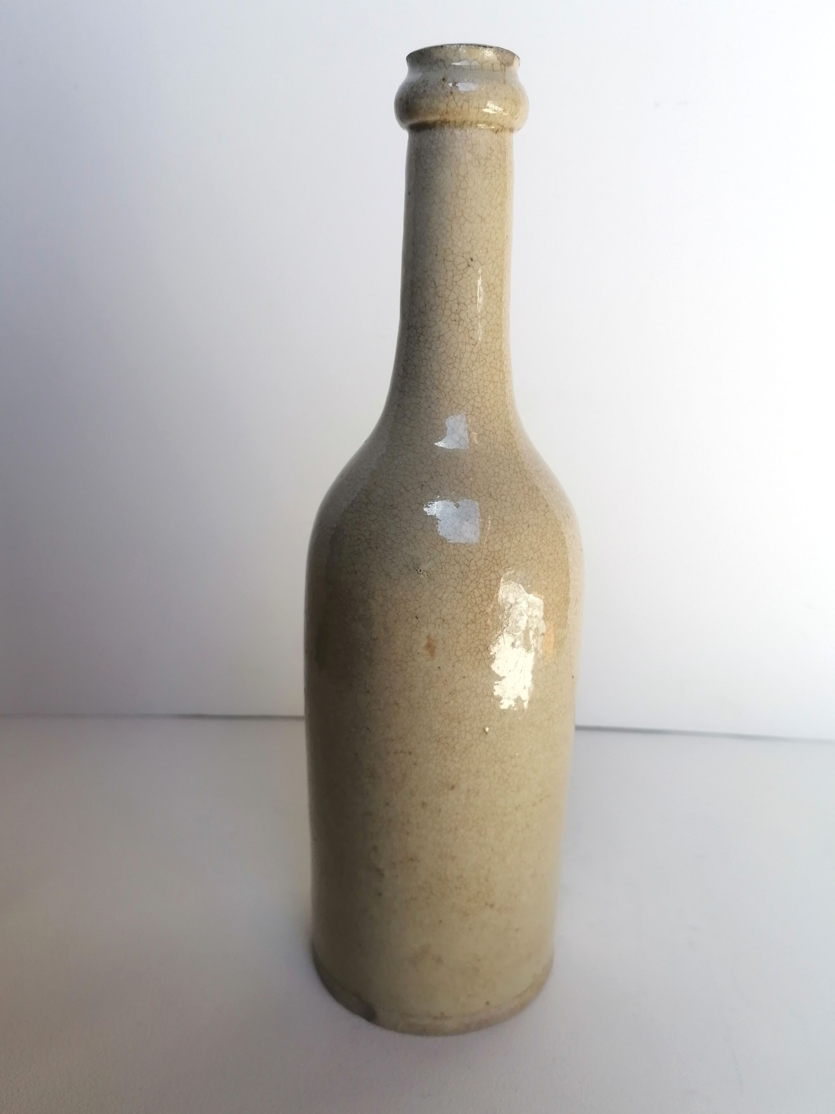 Cracked enamelled sandstone bottle