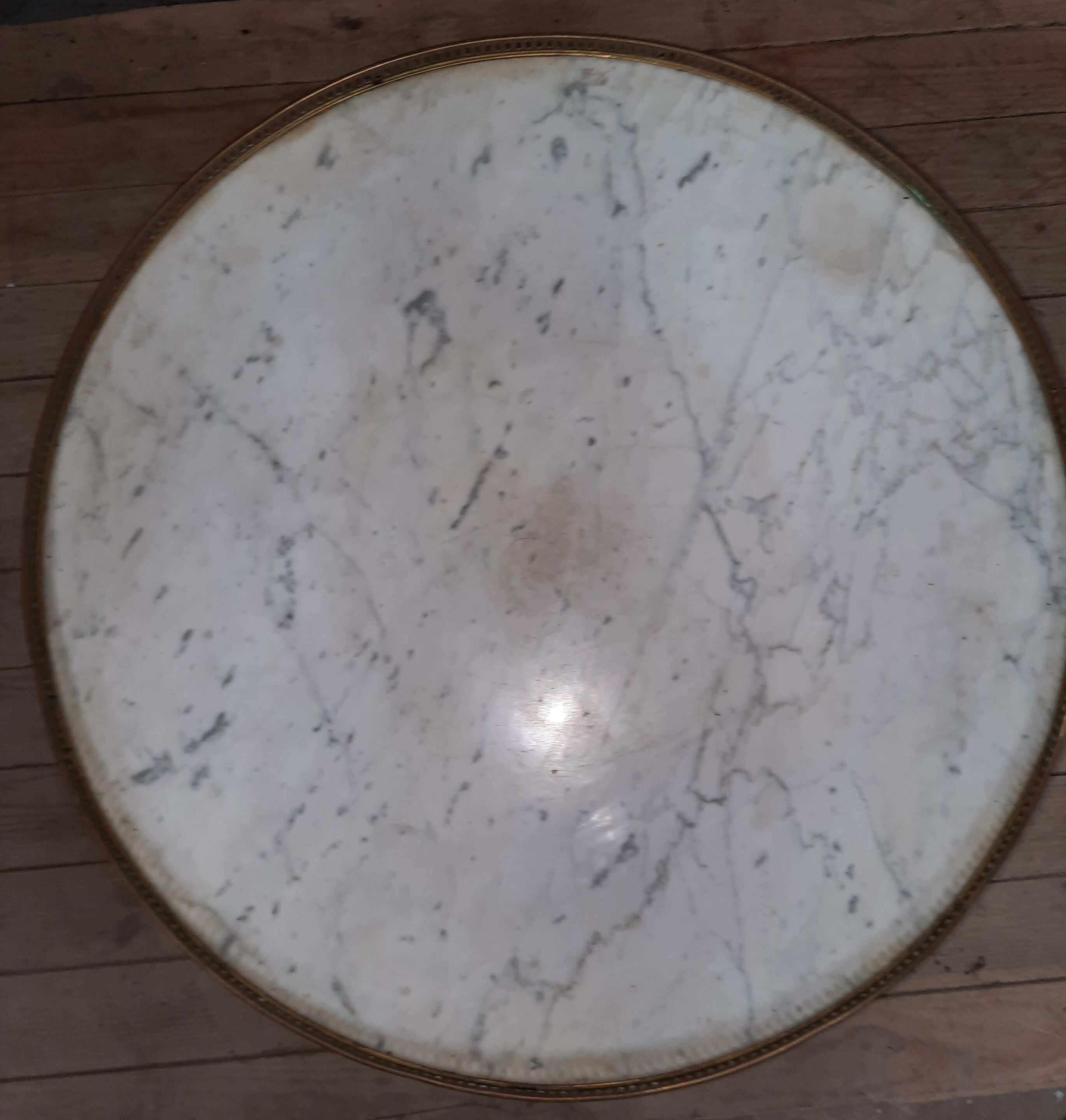 Tablr low dessu marble called "hot water bottle"