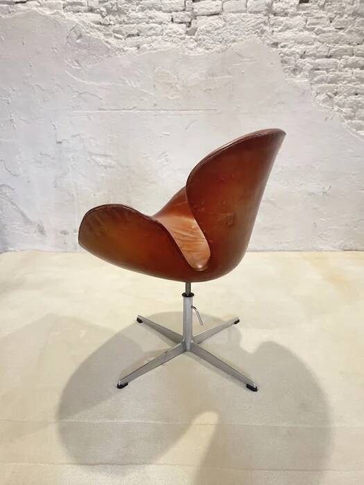 First edition Arne Jacobsen Swan chair, original patinated leather, 1950s