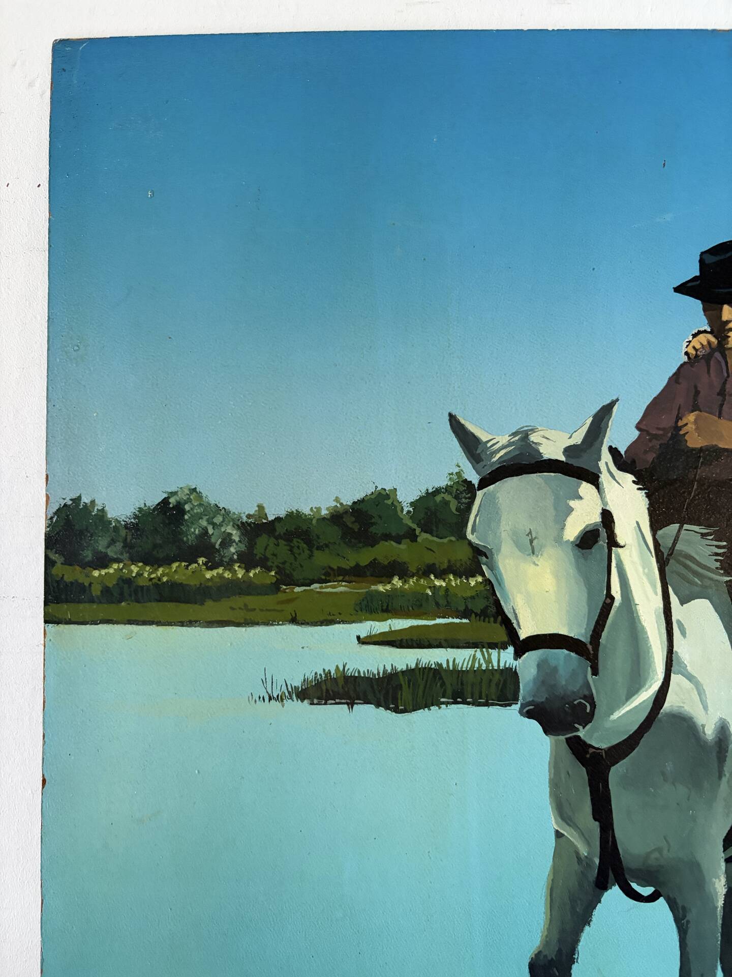 River crossing on horseback, on a sign by Campana.