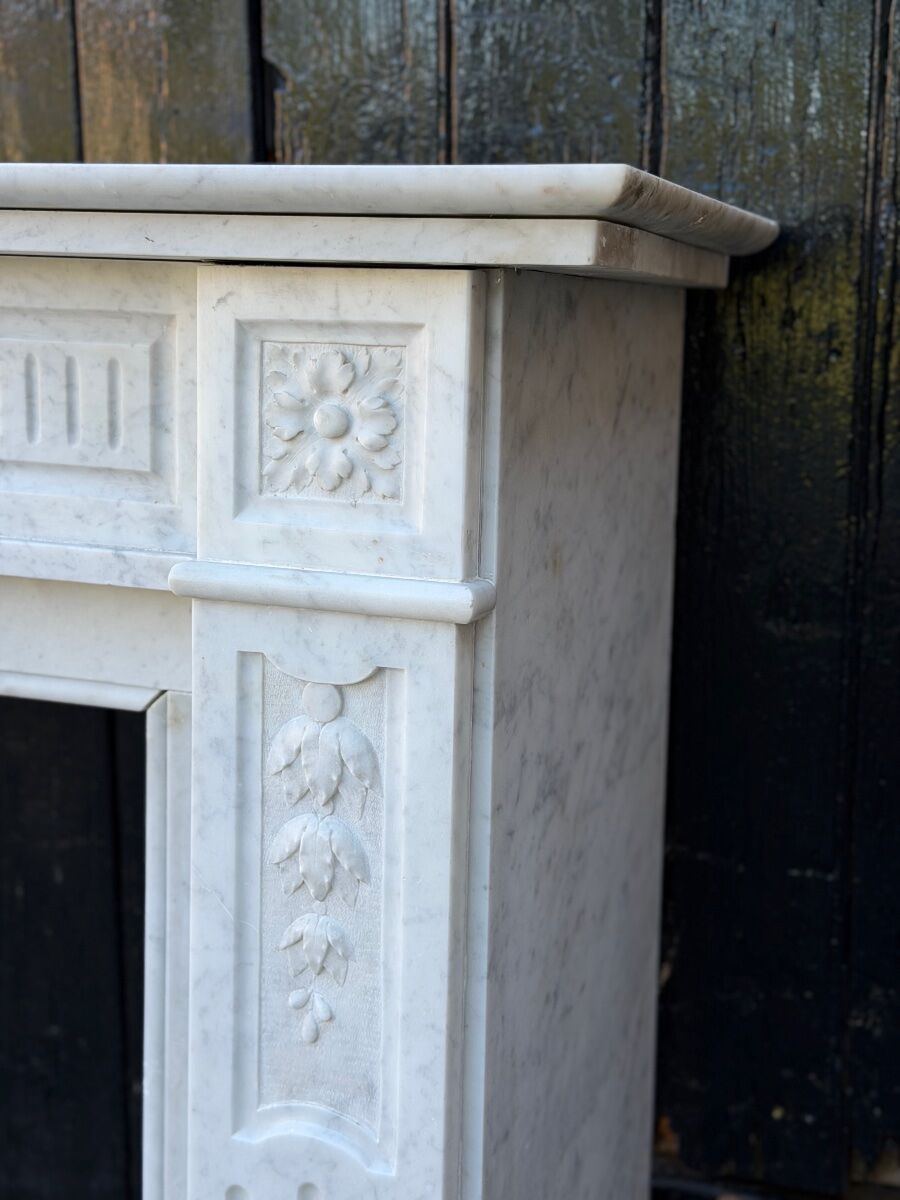 Louis XVI style fireplace in white Carrara marble, circa 1880.