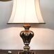 Florentine lamp in carved wood, gold leaf, silk shade.