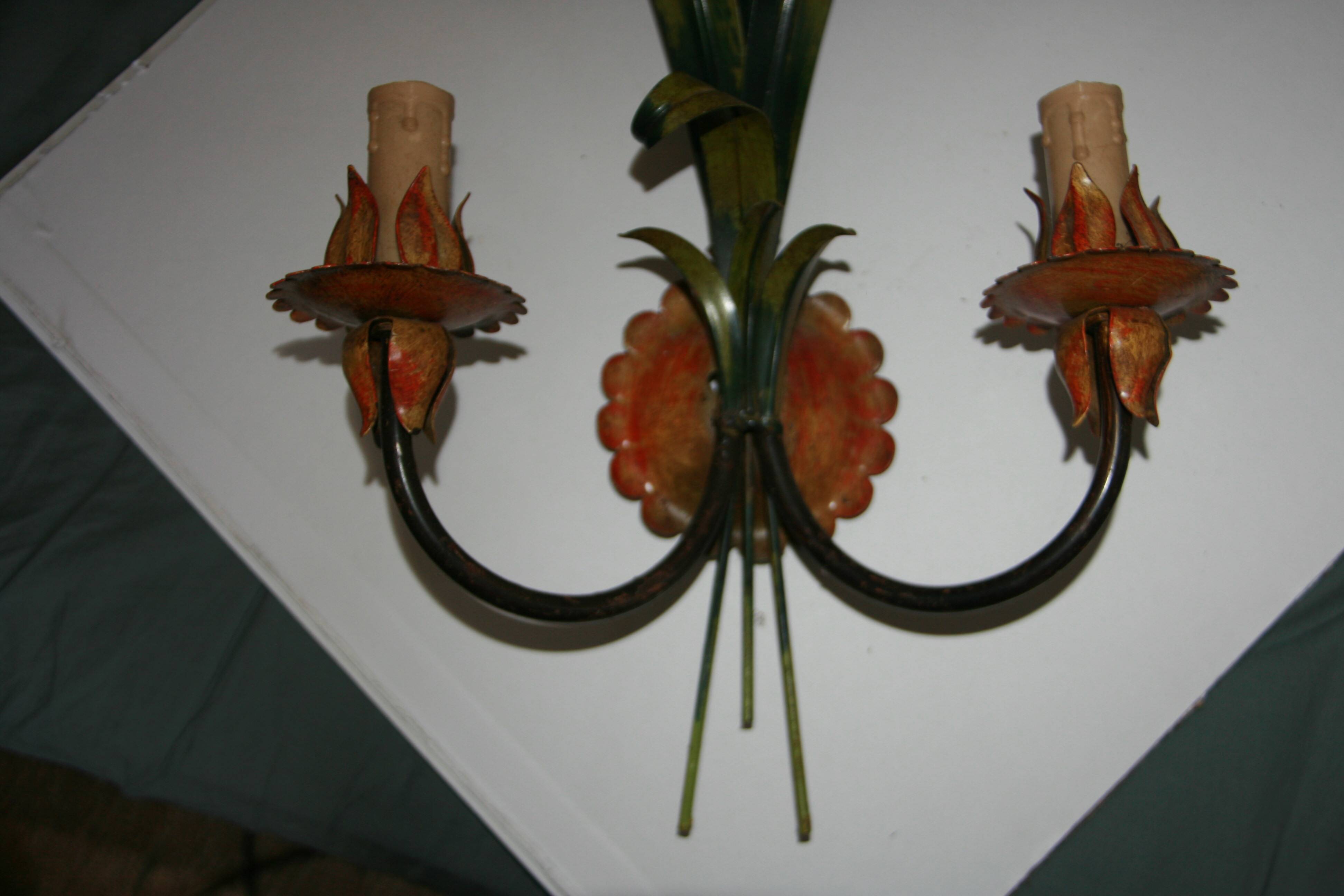 Pair of vintage floral wall sconces in Italian Florentine style metal.