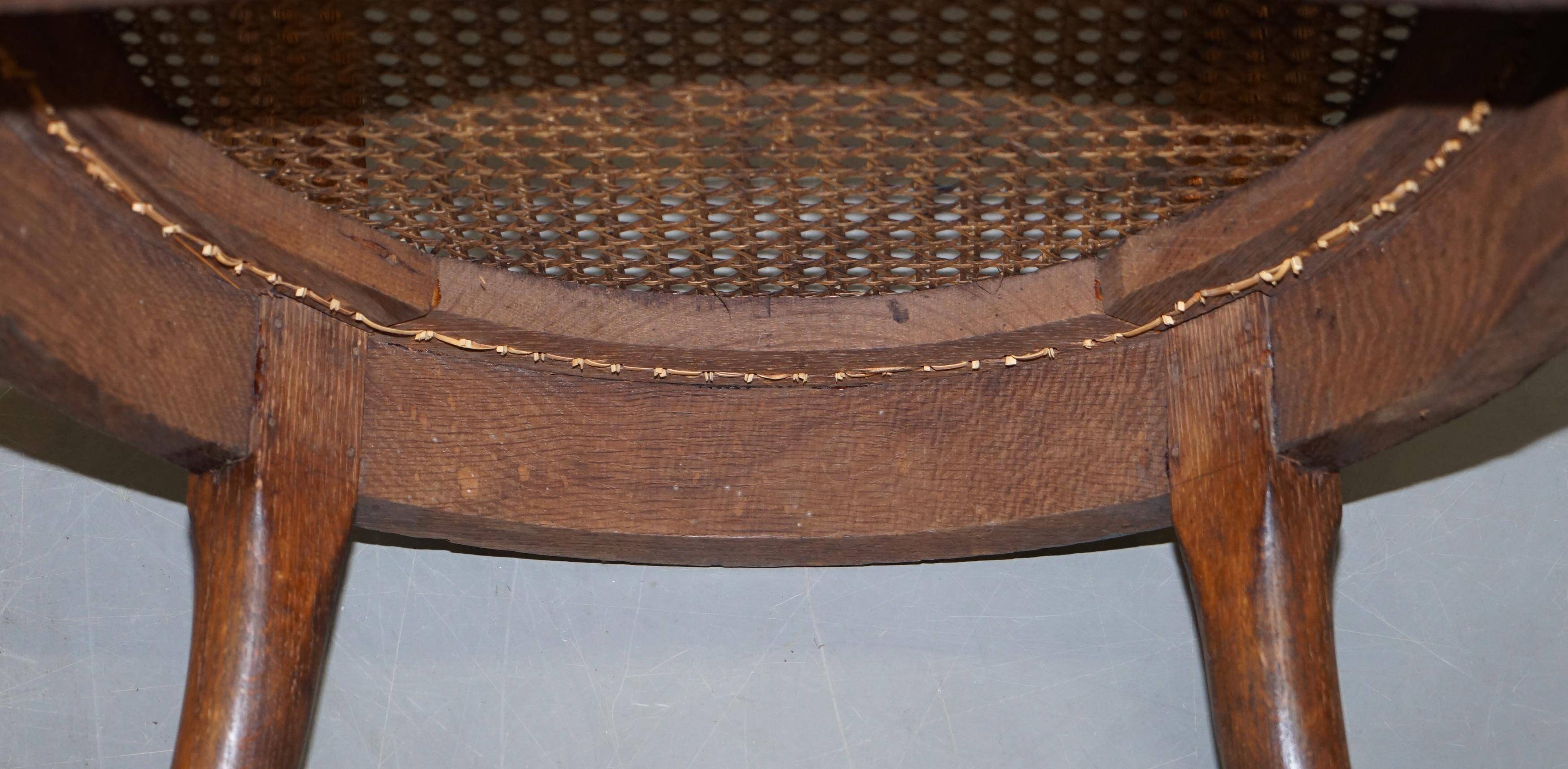 Antique Régence Bergère Armchair in Carved Oak with Lion Head Armrests