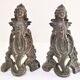Pair of bronze andirons with black patina, 19th century, female caryatids