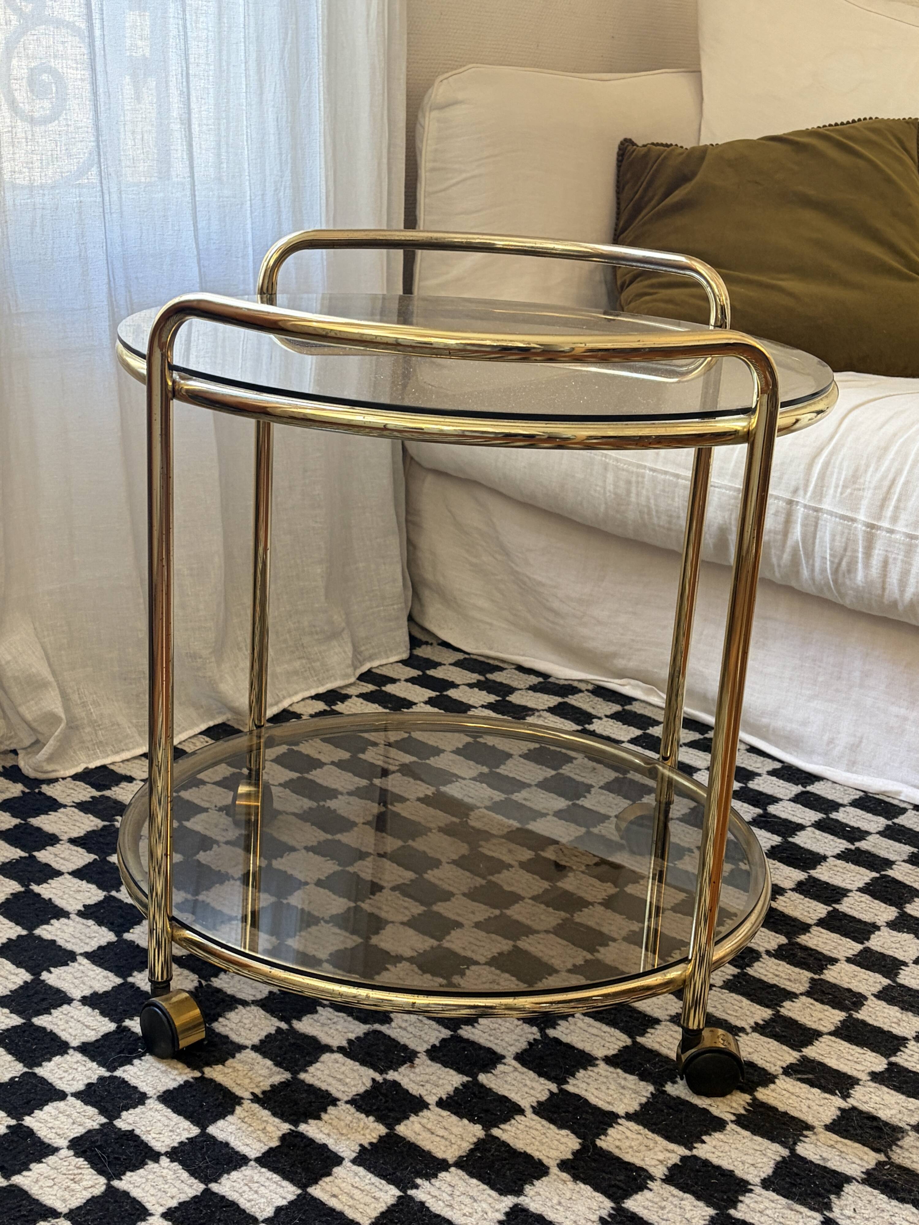 Vintage gold glass table on wheels