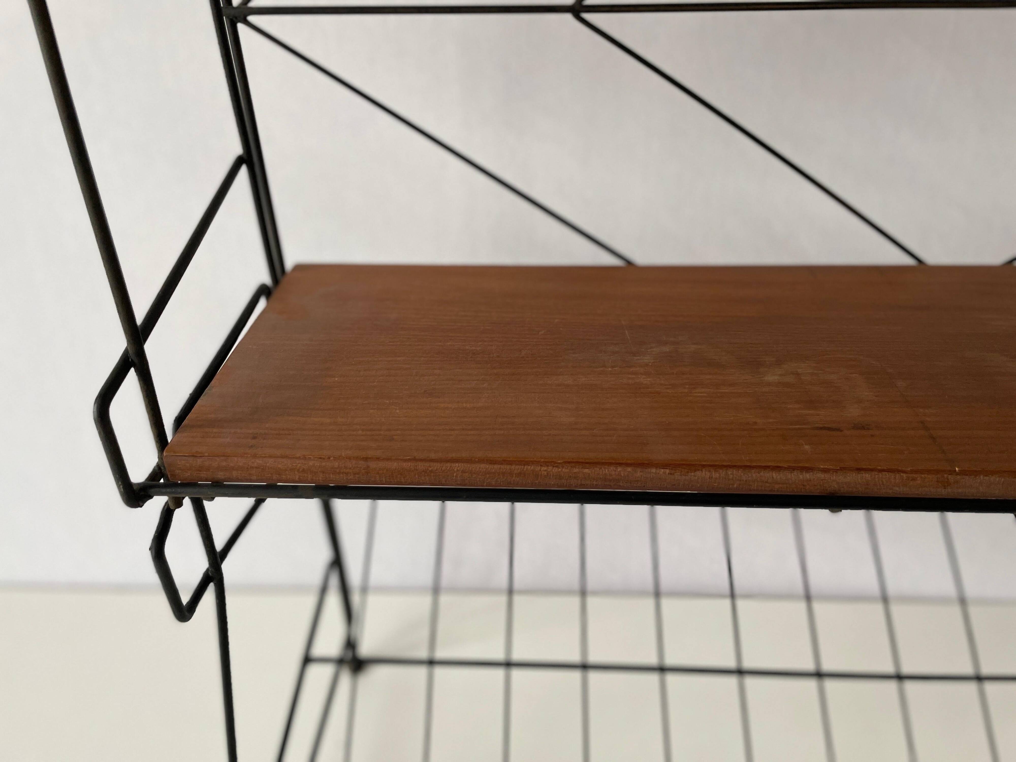 Free-standing shelf with a metal structure and 3 shelves, 1960s, Italy.