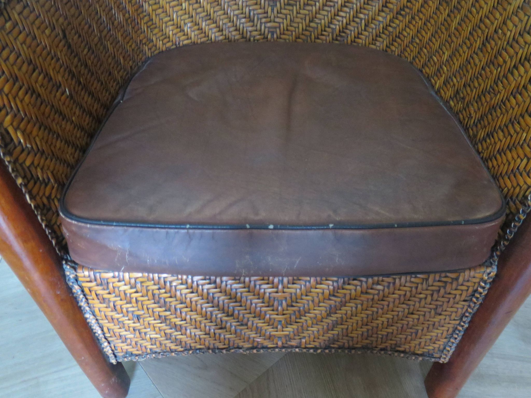 Woven rattan armchair and exotic wood in colonial style, 1980s.