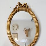 Oval mirror in gilded wood, 31x21 cm