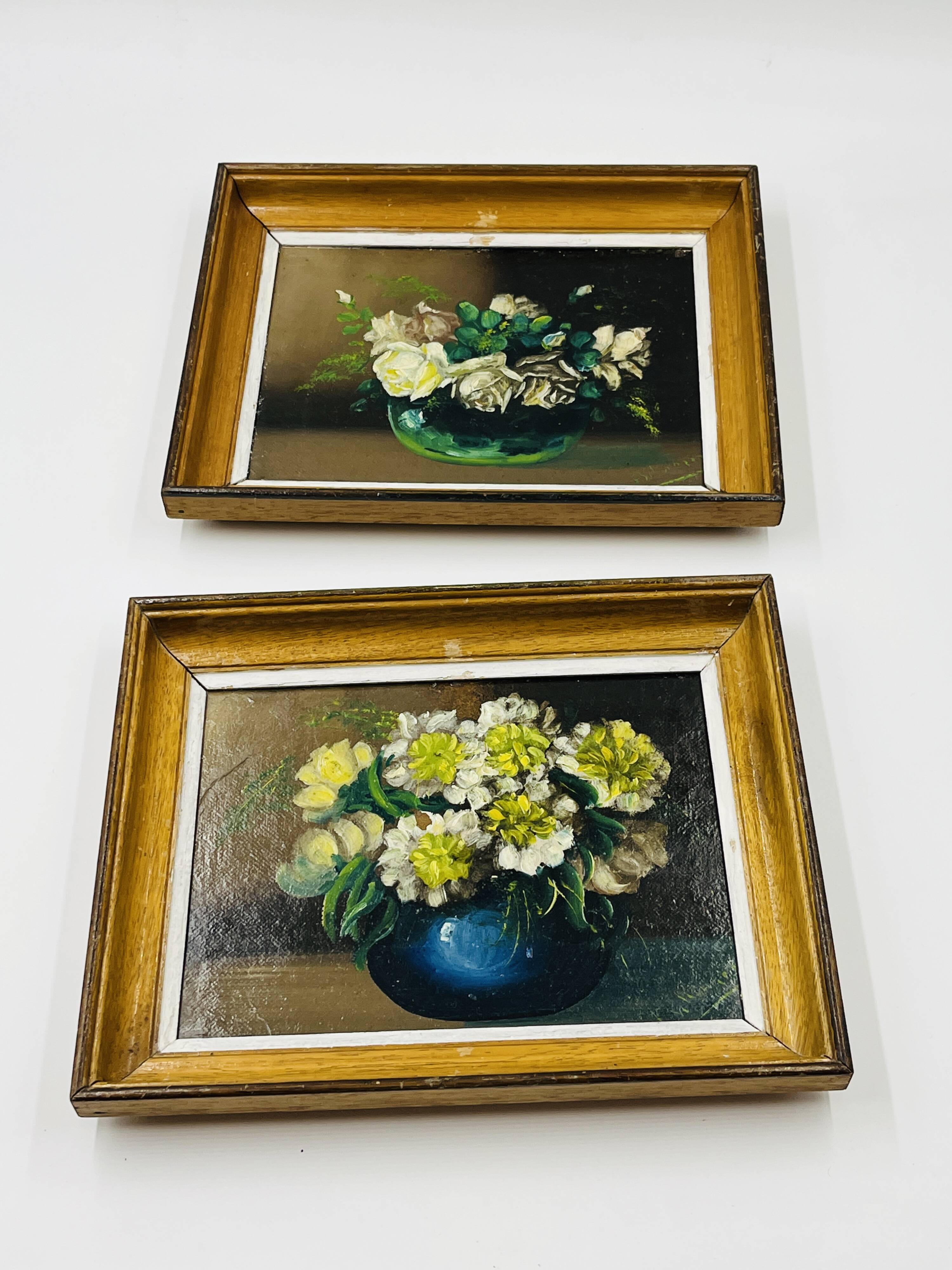 Pair of small framed vintage floral oils