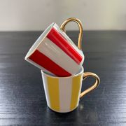 Pair of red and yellow striped cups