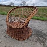 Old throne basket armchair in woven wicker