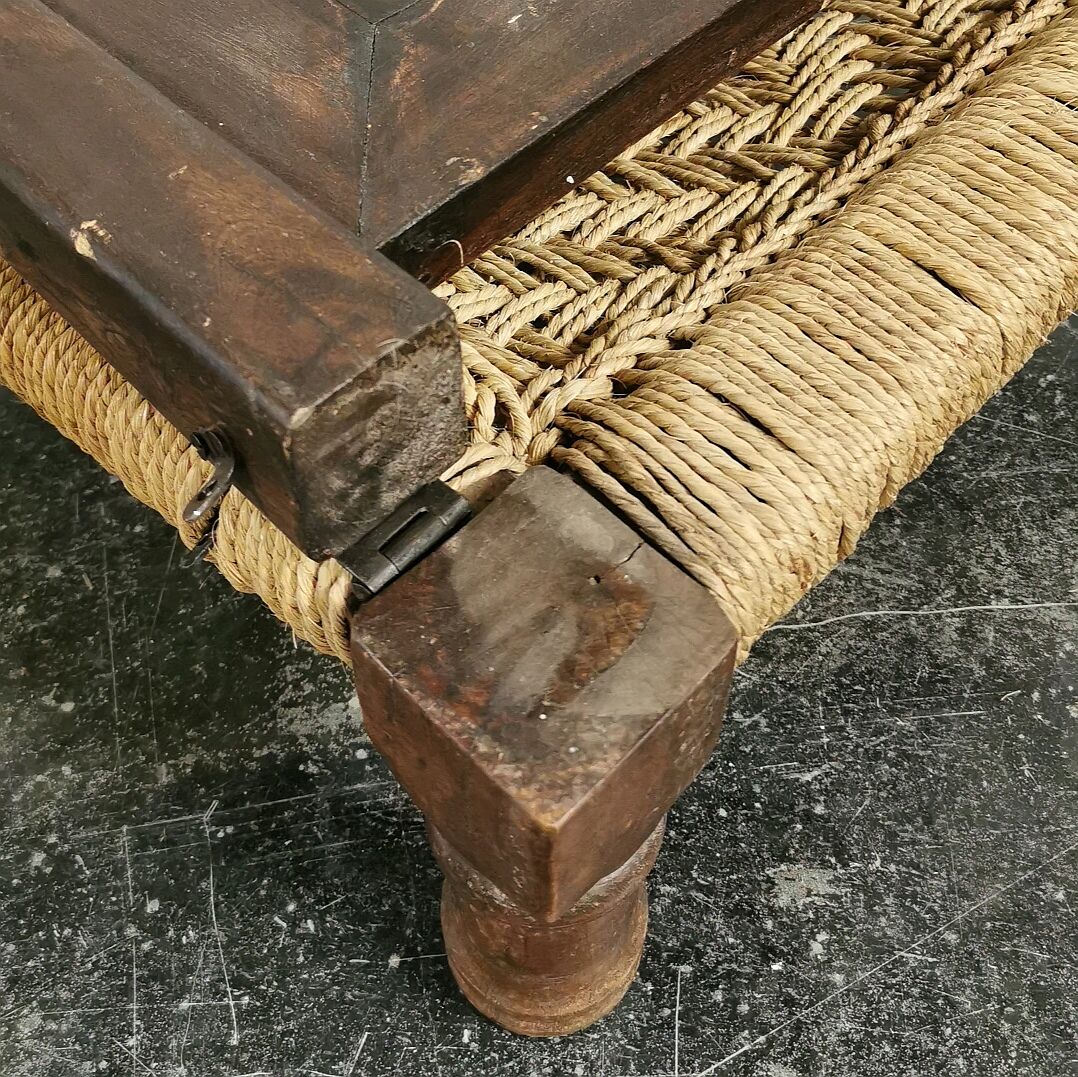 Ancient ethnic chair made of solid wood and rope