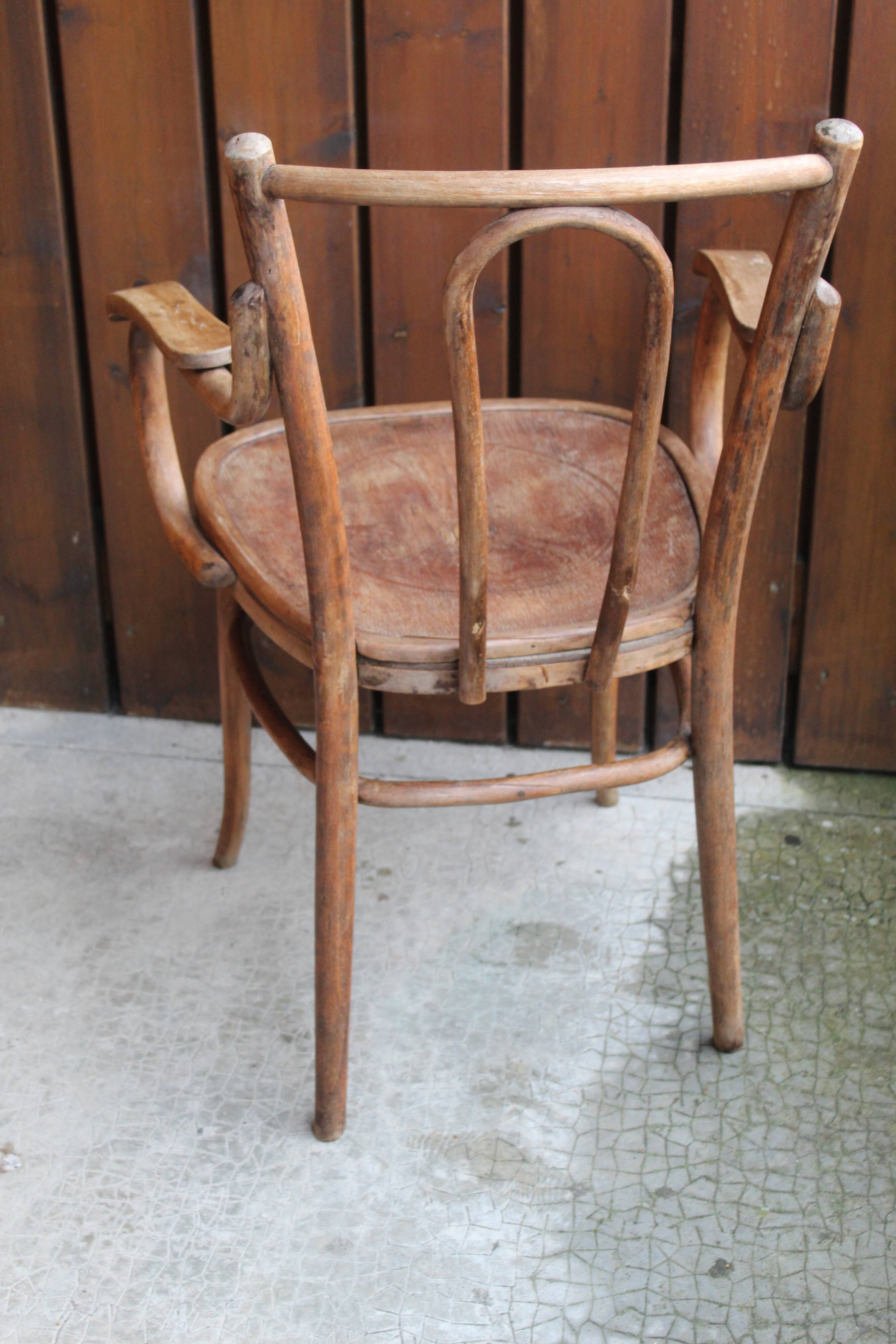 Curved wooden armchair