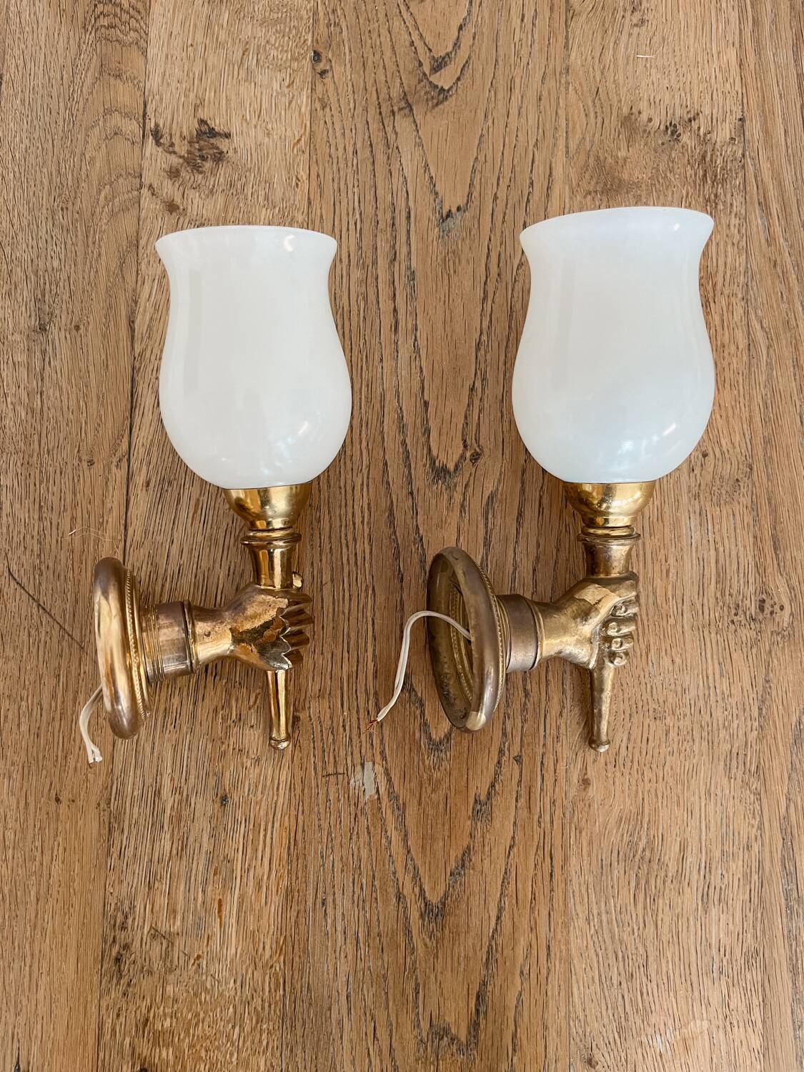 Set of 2 golden, bronze and brass torch wall lights