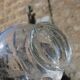 Vintage blown glass pitcher with bubbles, transparent.