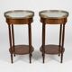 Pair of Louis XVI style bedside tables in mahogany, with marble tops.
