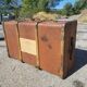 Old travel trunk made of wood and brass