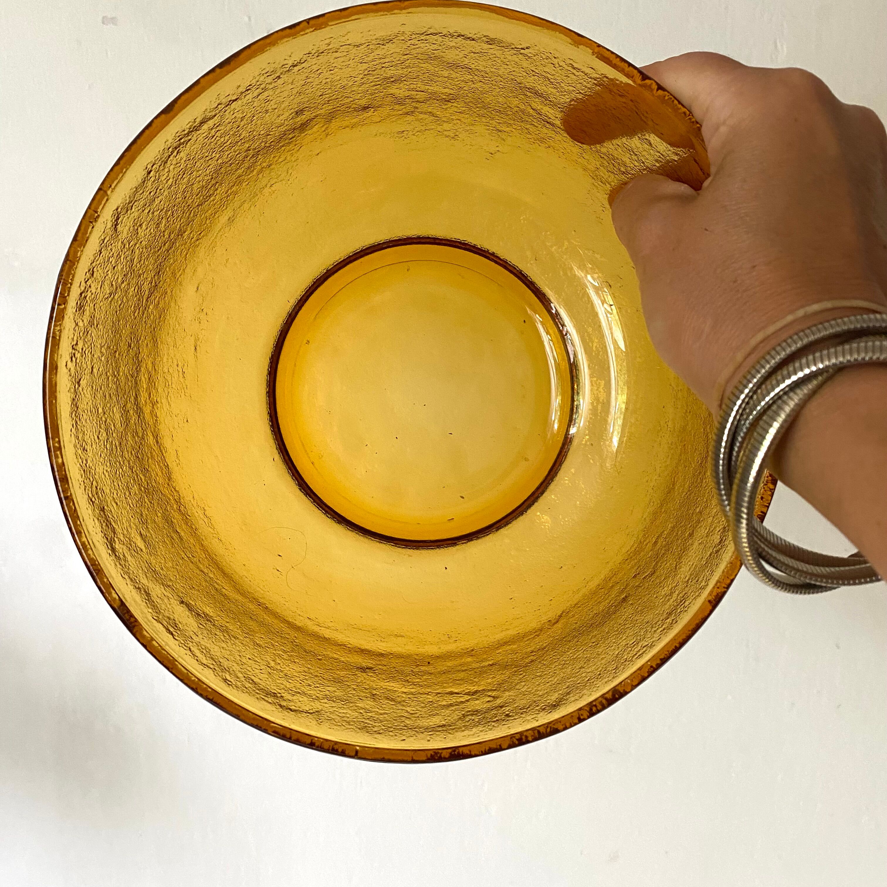 Salad bowl and bowls in amber glass, 70s