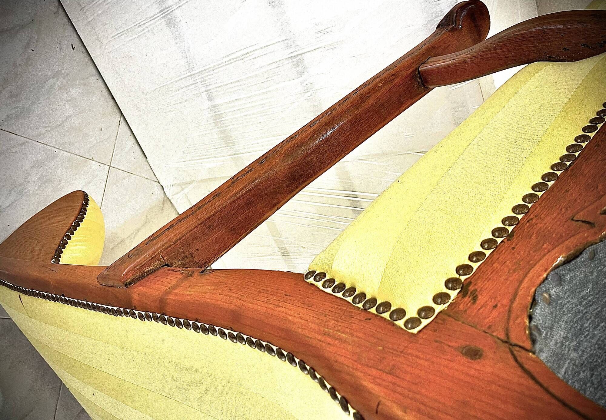 Wingback armchair in walnut in the French Regency style with stretcher in