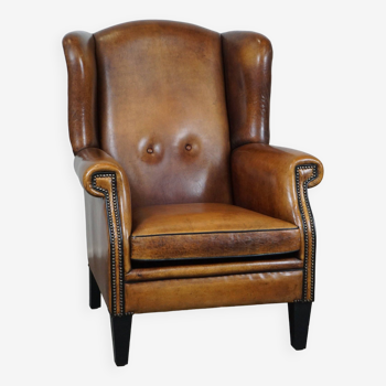 Fauteuil à oreilles en cuir de mouton