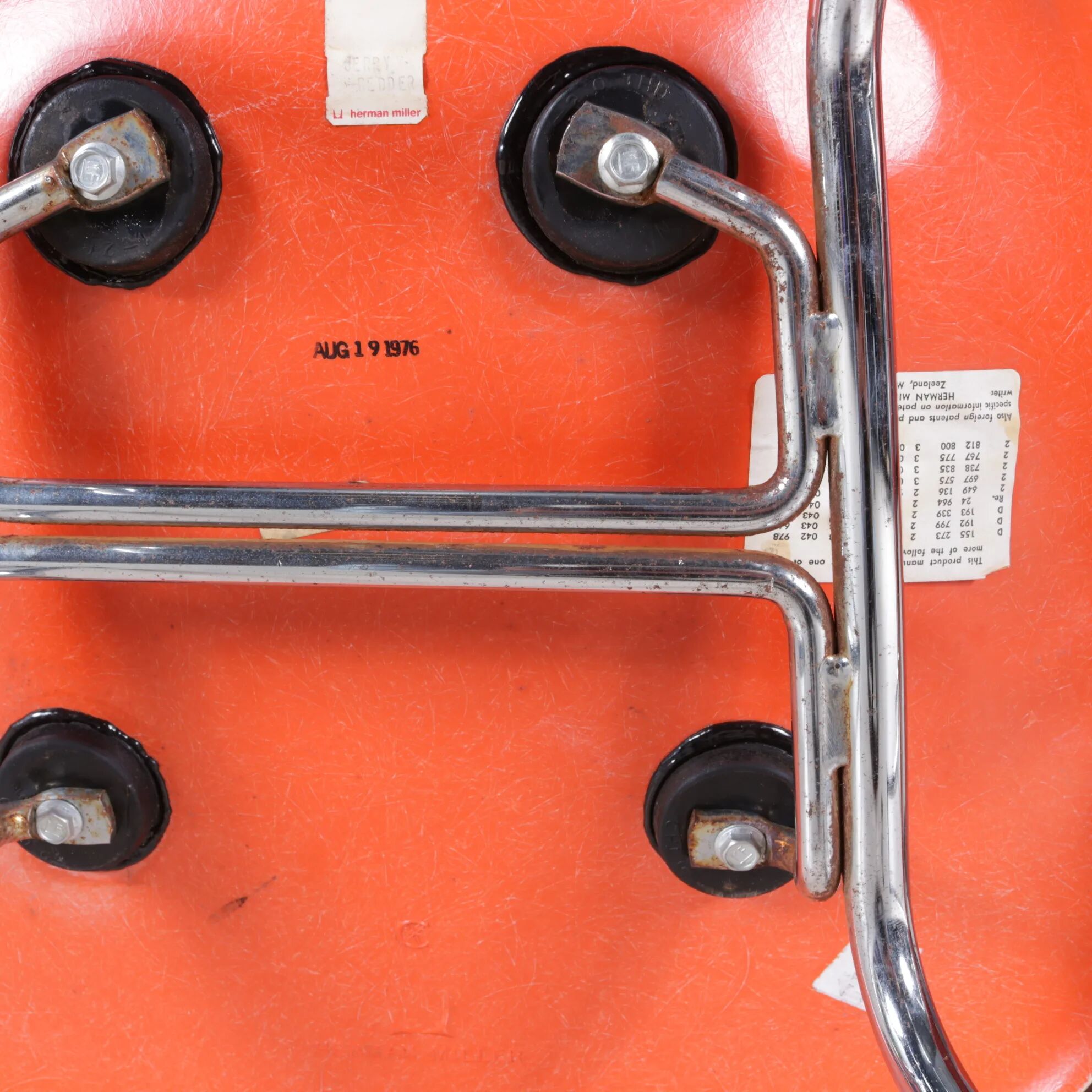 1960s dining chairs in orange fiberglass on chrome metal H-base / Charles & Ray Eames / Herman Miller, USA