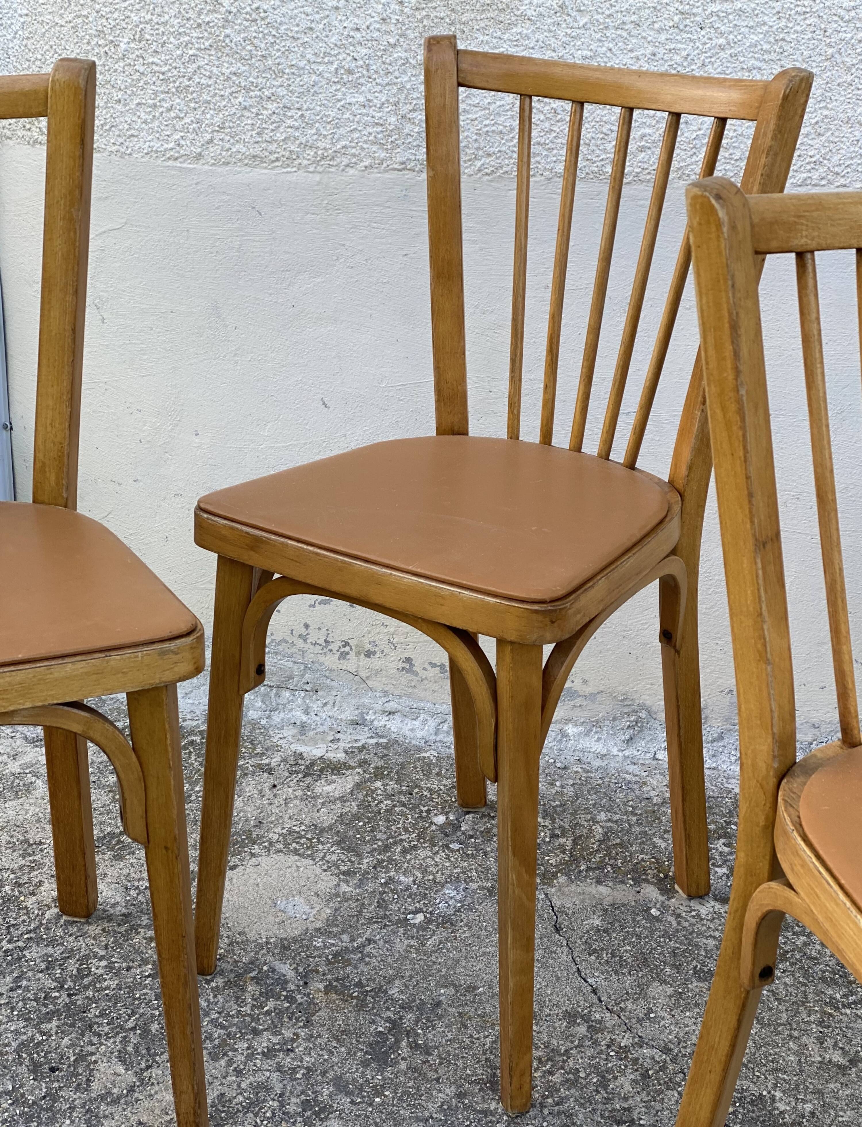 Série de 4 chaises bistros vintage 1950-60 assises Skaï