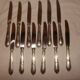 12 stainless steel table knives M.A. in "Louis XV" style, hunting horn model.