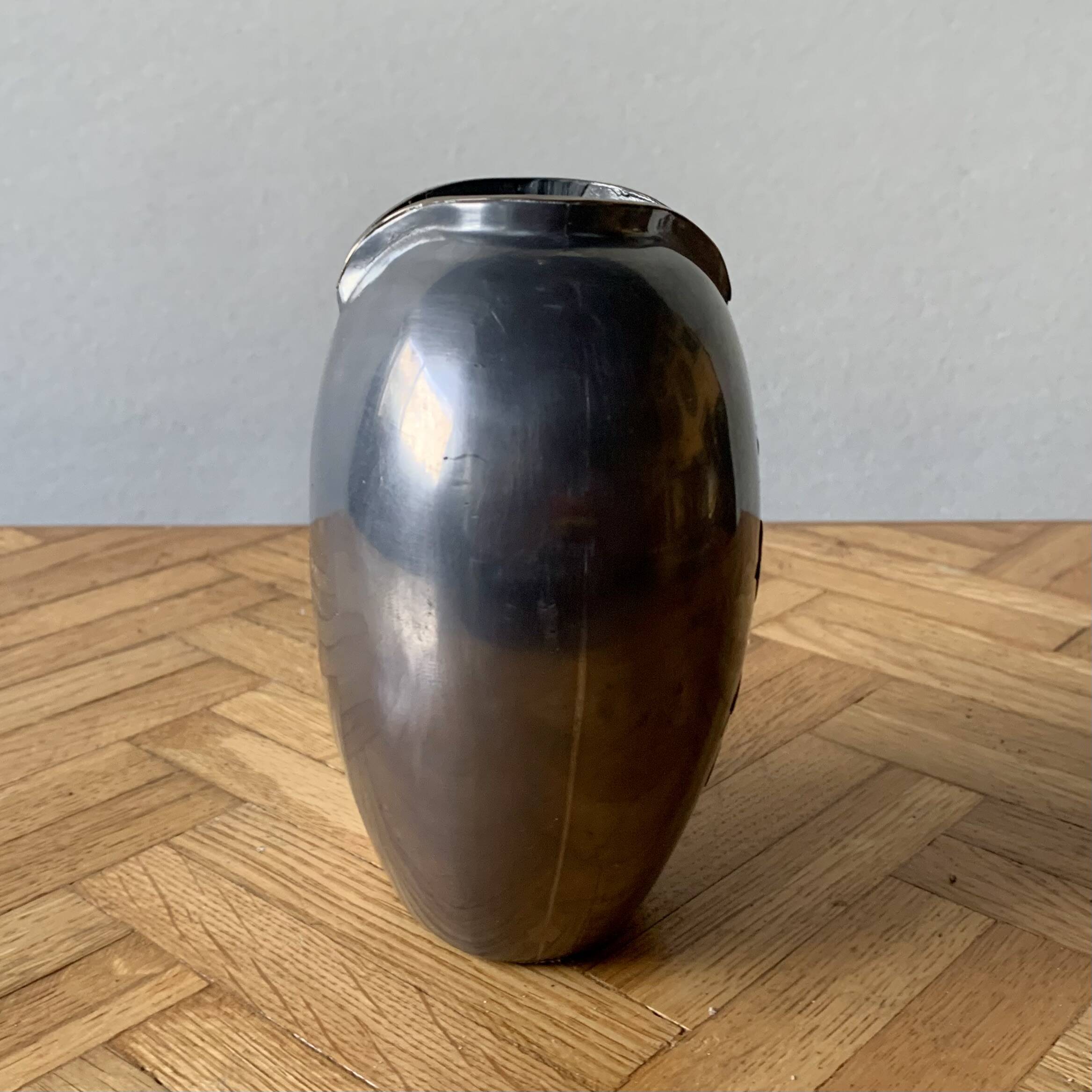 Small pewter vase decorated with brass flowers
