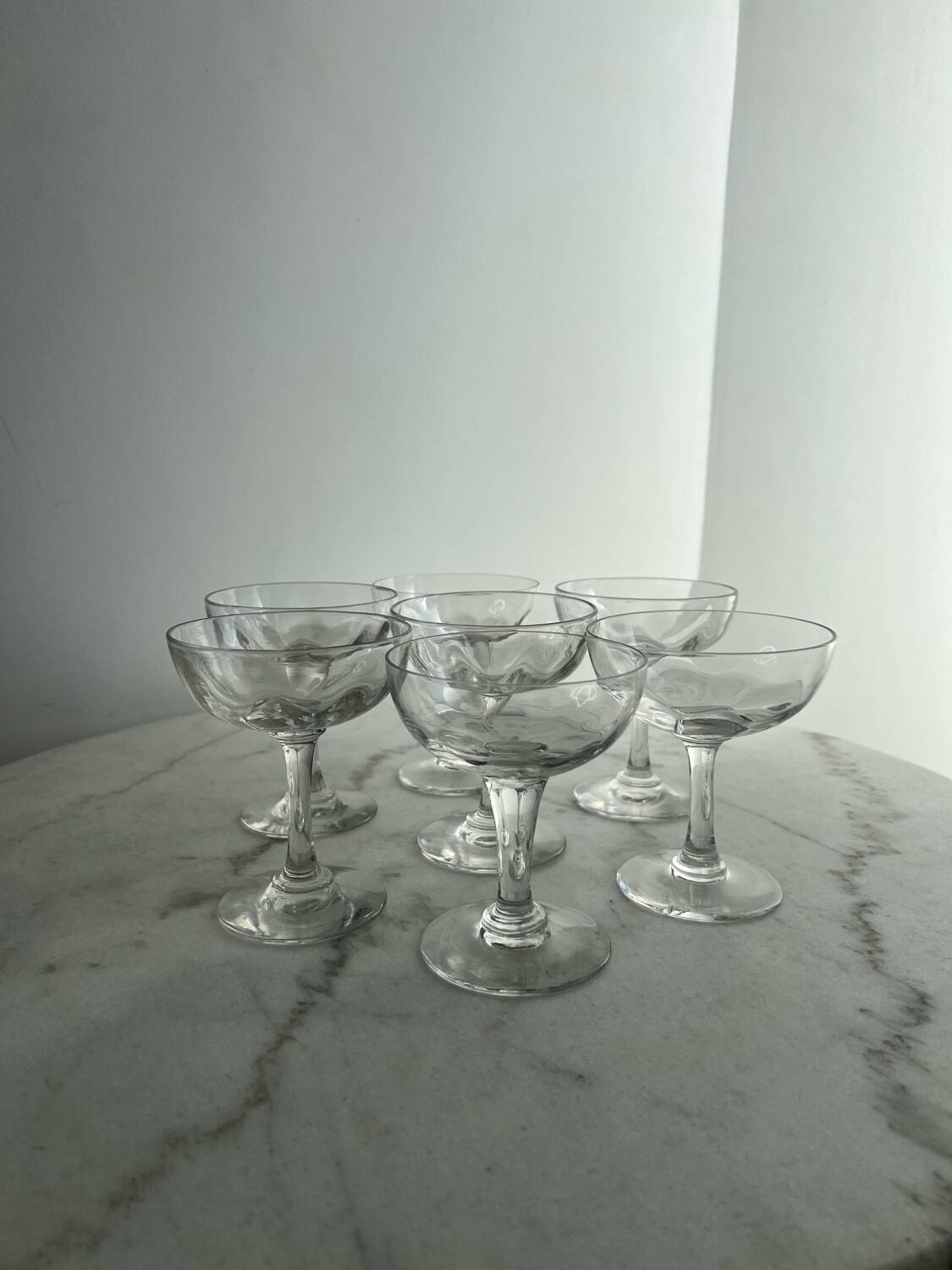 Set of seven blown glass stemmed glasses.