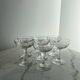 Set of seven blown glass stemmed glasses.