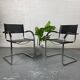 Pair of design armchairs in imitation leather chrome