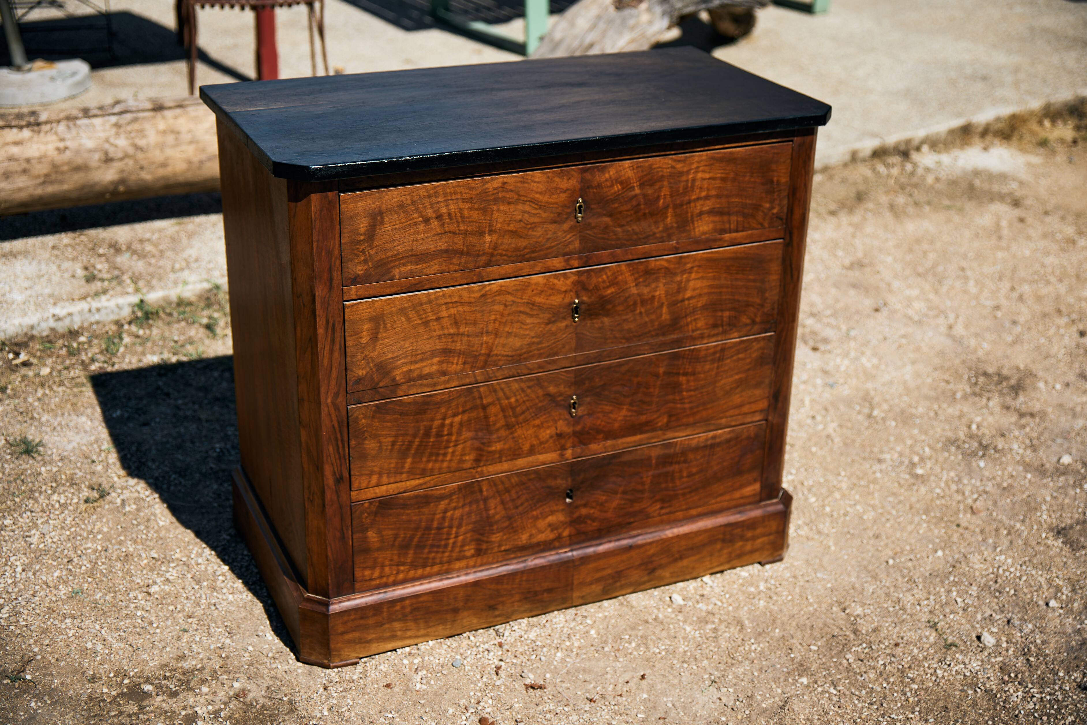 Small Louis-Philippe chest of drawers with four drawers, black top.