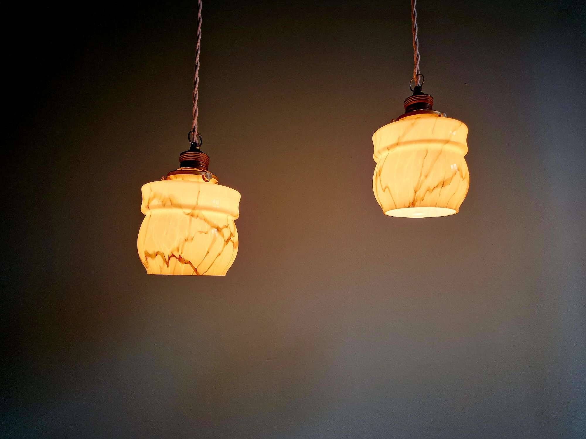 Art Deco trio of suspensions in opaline and marbled ouraline, Scailmont, 1920-30.