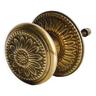 Golden metal door handle with sunflower decoration