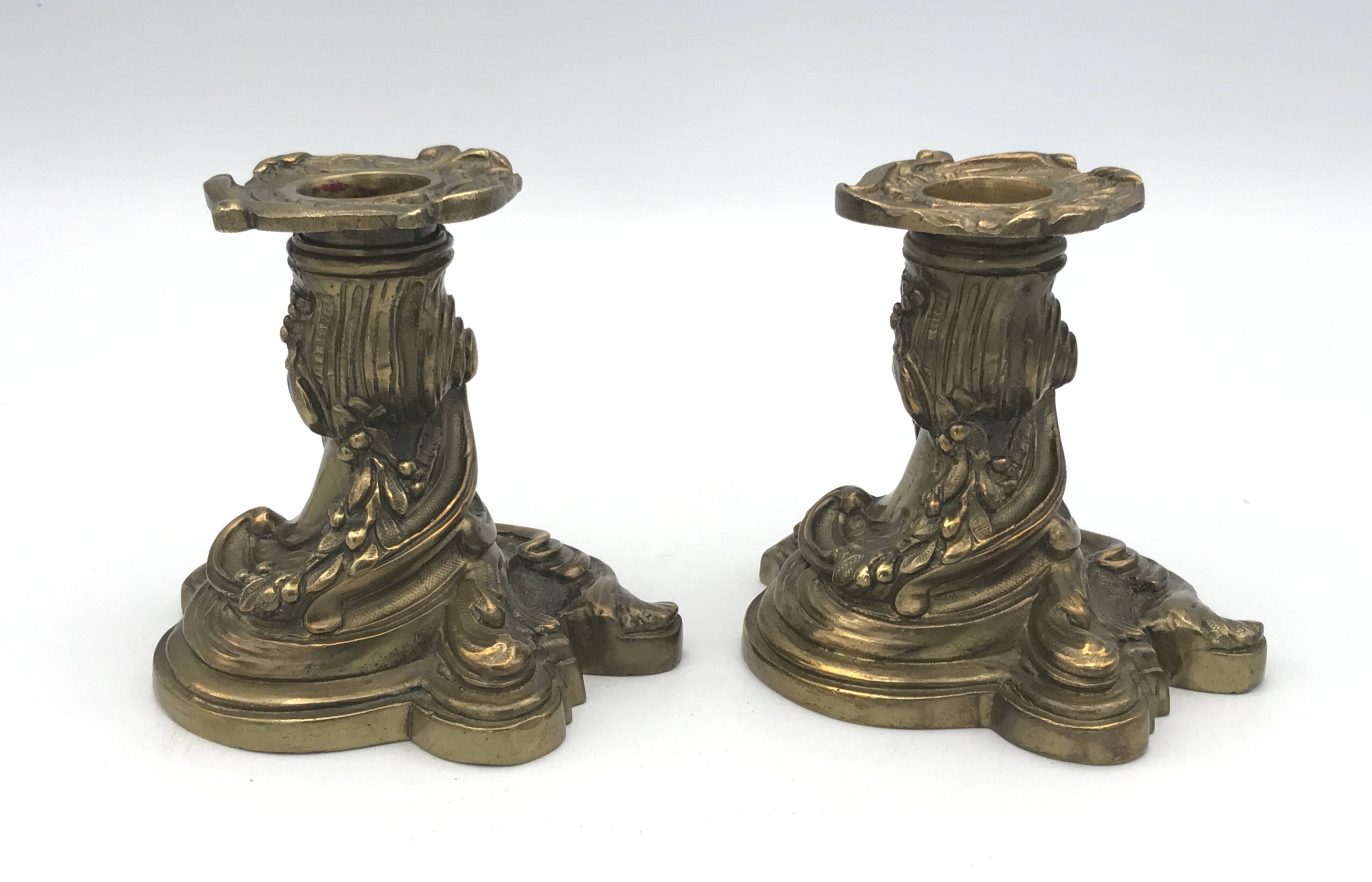 Pair of gilded bronze candlesticks with twisted decor and floral garlands, louis xv style