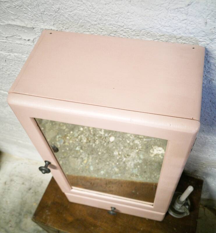 Pink bathroom cabinet