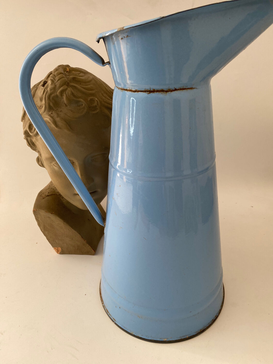 Blue watering can