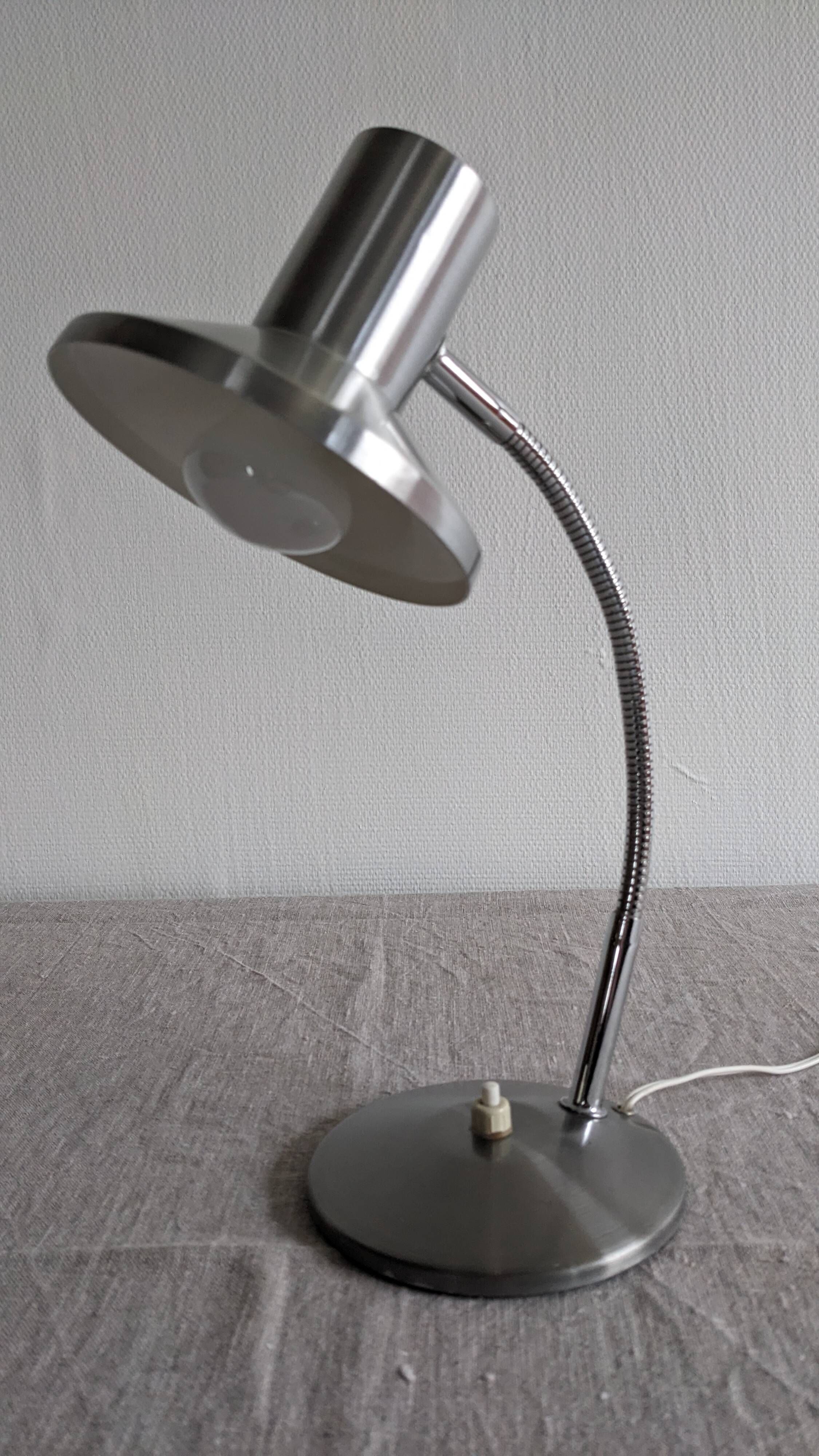 Articulated bedside lamp or wall light in aluminium, France circa 1960.